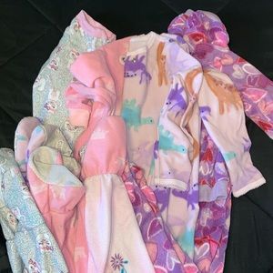 Bundle of 4 footie pajamas. Two are 3T and the other two are 4T